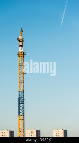 Crane at building site with houses seen in the background. Stockholm, Sweden. Stock Photo