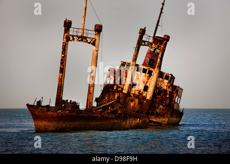 Ship wreck just off the beach near the Royal Lodge, Sine Saloum Delta, Senegal Stock Photo