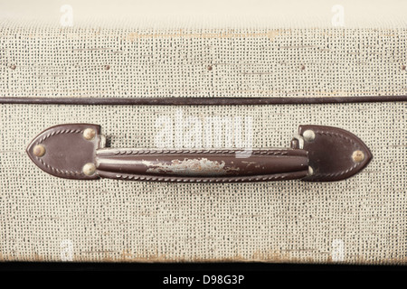 Closeup of handle on old retro style suitcase Stock Photo