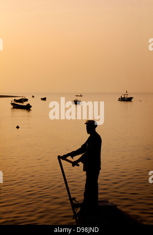 Fishing boats crossing the Saloum Delta, Senegal, Africa Stock Photo