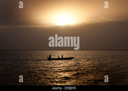 Fishing boats crossing the Saloum Delta, Senegal, Africa Stock Photo