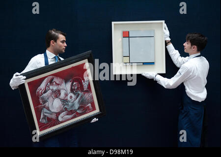 London,UK - 14 June 2013: Sotheby's employees bring a work by Piet Mondrian entitled “Composition with red, Yellow amd Blue, 1927) (Est. £4.5-6.5 million) (R) and ‘Etreinte’ by Pablo Picasso (Est. £1.5-2 million) (L) during the preview of this summer auction at Sotheby's. Credit:  Piero Cruciatti/Alamy Live News Stock Photo