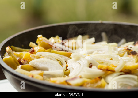 fried potatoes with onions in a frying pan Stock Photo