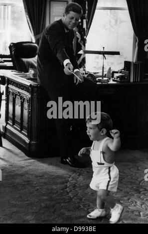 John Fitzgerald Kennedy (May 29, 1917 – November 22, 1963), 35th President of the United States, serving from 1961 with his son at the White House Stock Photo