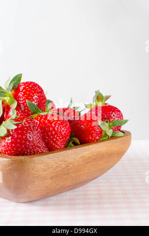 Strawberries in wooden bowl isolated on white background cutout Stock ...