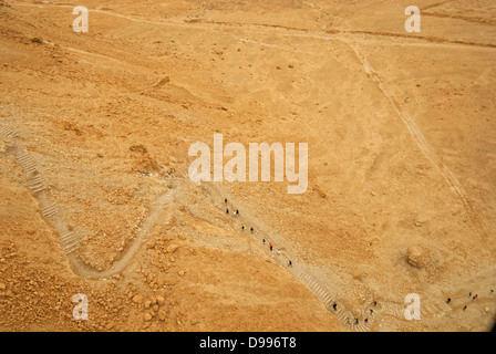 Tourists on Roman Ramp Path (aka Snake Path) on the monument floor at Masada National Park, Israel Stock Photo