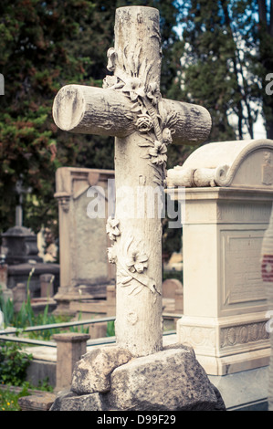 A stone cross on a gravestone in the English Cemetery, Florence, Italy Stock Photo