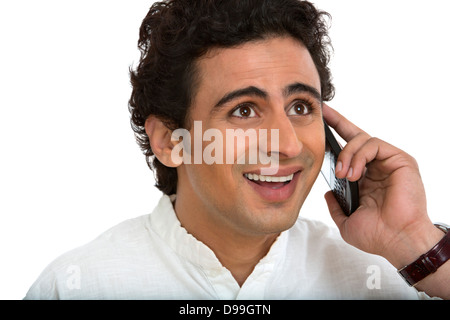 Man talking on a mobile phone and looking surprised Stock Photo