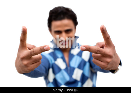 Portrait of a man showing victory sign Stock Photo
