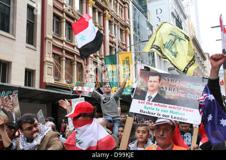 Sydney, NSW, Australia. 15 June 2013. The rally assembled outside Sydney Town Hall where speakers addressed the crowd before they marched to Foreign Minister Bob Carr’s office chanting in support of Syrian President Bashar al-Assad. Credit: Credit:  Richard Milnes / Alamy Live News. Stock Photo