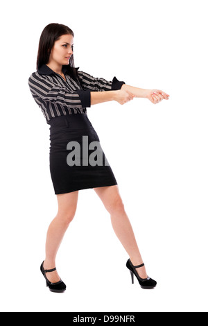 Full length portrait of a businesswoman pulling an imaginary rope isolated on white background Stock Photo
