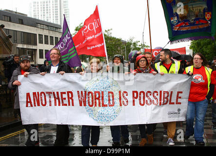 Belfast, Northern Ireland, UK. 15th June 2013. Anti-G8 protesters descend upon the city just two days before Barack Obama is due to arrive in Belfast and other World Leaders are due to arrive in Northern Ireland for the 39th G8 Summit in County Fermanagh  - Protest gets under way in Belfast Credit:  Kevin Scott/Alamy Live News Stock Photo