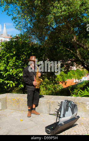 Man playing saxophone in the street Stock Photo