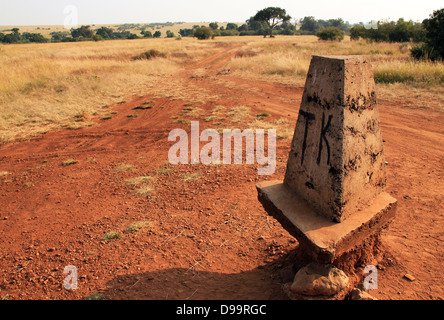 Border Stone between Kenya and Tanzania (Maasai Mara and Serengeti) Stock Photo