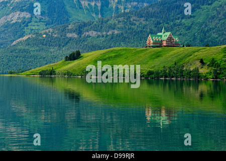 Prince of Wales Hotel reflected in Middle Waterton Lake Waterton Lakes National Park Alberta Canada Stock Photo