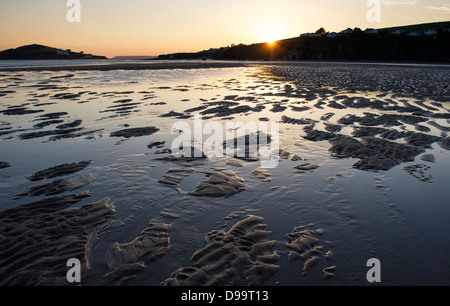 Rippled sand and sea water on Bantham beach at sunset.  Devon, England Stock Photo