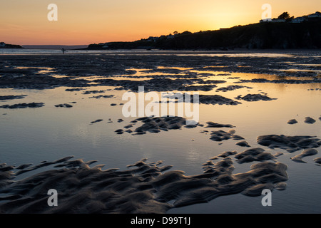 Rippled sand and sea water on Bantham beach at sunset.  Devon, England Stock Photo