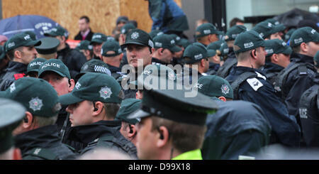 Belfast , Northern Ireland, UK. 15th June 2013. -G8 protesters descend upon the city just two days before Barack Obama is due to arrive in Belfast and other World Leaders are due to arrive in Northern Ireland for the 39th G8 Summit in County Fermanagh  - Police cover Belfast ahead of the Anti-G8 Protests Credit:  Kevin Scott/Alamy Live News Stock Photo