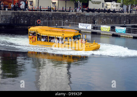 People at Salthouse Dock with Albert Dock converted 