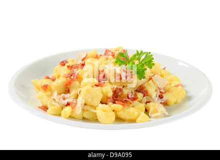 Small potato dumplings with bacon and white cabbage Stock Photo
