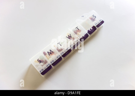 A week pill keeper with days of the week marked on each compartment. USA. Stock Photo