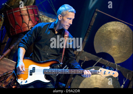 Swedish folk-rock group Hoven Droven performing at the Cross Culture Festival in Warsaw, Poland. Pedro Blom on bass guitar Stock Photo