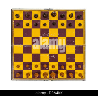 Grungy worn vintage chess board and pieces on white. Stock Photo