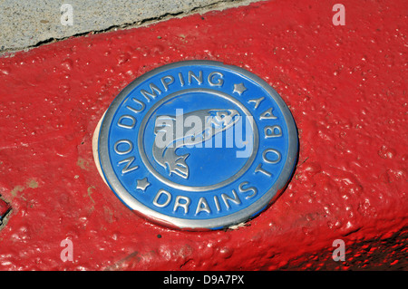 Anti-pollution sign on a sidewalk in Tiburon, California - showing that the culvert drains directly into San Francisco Bay Stock Photo