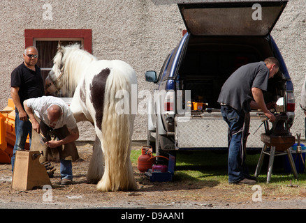 A mobile Farrier hot shoeing horses at the Appleby Horse Fair, Appleby-in-Westmorland, Cumbria, England, U.K. Stock Photo