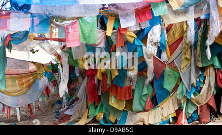 Tibetan prayer flags with Buddhism symbols and prayers written in sanskrit have been used in Buddhism for hundreds of year Stock Photo