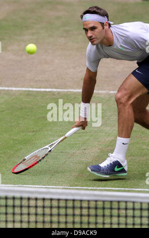 Halle/ Westphalia, Germany. 16th June, 2013. Swiss tennis player Roger Federer plays the ball during the final against Youzhny from Russia at the ATP tournament in Halle/ Westphalia, Germany, 16 June 2013. Photo: OLIVER KRATO/dpa/Alamy Live News Stock Photo