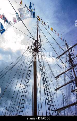 Rouen, France. 15th June, 2013. Mast, rigging with flags and rope ladders of a tall ship at the Rouen Armada. Sunny day with cloudy blue sky. Dramatic view. Credit:  Christine Gates/Alamy Live News Stock Photo