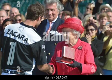 Windsor, UK. 16th June, 2013. Her Majesty The Queen presents the The Cartier Queen's Cup to Facundo Pieres [1] of team Zacara.  Zacara beat El Remanso in the Final 15-9.  The Cartier Queen's Cup was played at Guards Polo Club Smiths Lawn Windsor Great Park on Sunday 16th June. Credit: Stephen Bartholomew/Stephen Bartholomew Photography/Alamy Live News Stock Photo