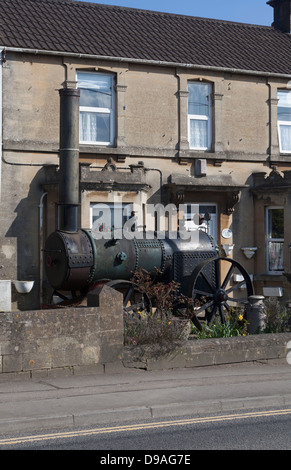 Old Steam Engine in the garden of house Box Stock Photo