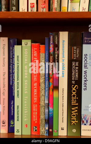 Social Work reference books on a bookshelf Stock Photo