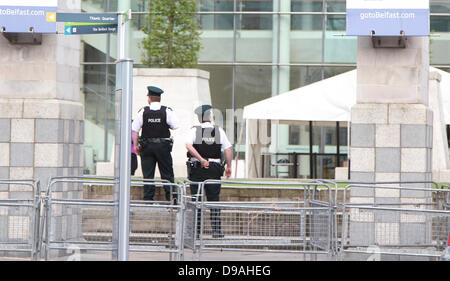 Belfast , Northern Ireland. 15th June, 2013. Just 12 hours before US President Barack Obama arrives in Belfast a huge police operation swings into place in the city ahead of the G8 Summit in Northern Ireland - Police patrol the Waterfront hall Stock Photo