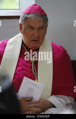 Enniskillen, United Kingdom. 16th June 2013. The Catholic Bishop of Clogher, Liam MacDaid, listens to the press conference after the service. The Most Reverend John Sentamu, the Church of England Archbishop of York led a church service for the 'Enough food for everyone if' campaign in the Cathedral of Enniskillen. John Sentamu called in his sermon for action against government corruption and poverty. Credit:  Michael Debets/Alamy Live News Stock Photo