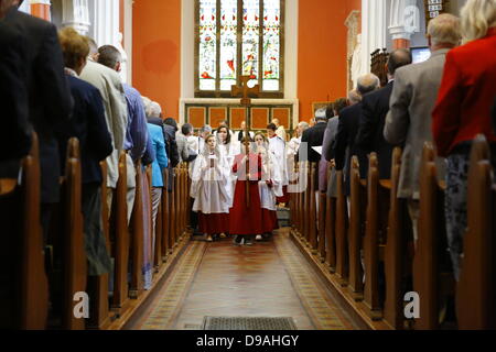 Enniskillen, United Kingdom. 16th June 2013. The choir moves out of the church at the end of the service. The Most Reverend John Sentamu, the Church of England Archbishop of York led a church service for the 'Enough food for everyone if' campaign in the Cathedral of Enniskillen. John Sentamu called in his sermon for action against government corruption and poverty. Credit:  Michael Debets/Alamy Live News Stock Photo