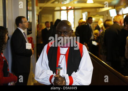 Enniskillen, United Kingdom. 16th June 2013. The Most Reverend John Sentamu, the Archbishop of York, leaves the church after the service. The Most Reverend John Sentamu, the Church of England Archbishop of York led a church service for the 'Enough food for everyone if' campaign in the Cathedral of Enniskillen. John Sentamu called in his sermon for action against government corruption and poverty. Credit:  Michael Debets/Alamy Live News Stock Photo