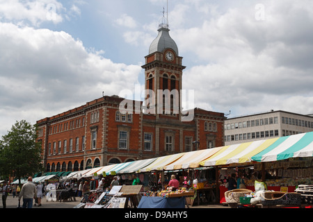 The old chesterfield market hall with the outdoor market in front. Derbyshire England UK English market town, grade II listed building Stock Photo