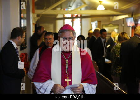 Enniskillen, United Kingdom. 16th June 2013. The Catholic Bishop of Clogher, Liam MacDaid, leaves the church at the end of the service. The Most Reverend John Sentamu, the Church of England Archbishop of York led a church service for the 'Enough food for everyone if' campaign in the Cathedral of Enniskillen. John Sentamu called in his sermon for action against government corruption and poverty. Credit:  Michael Debets/Alamy Live News Stock Photo