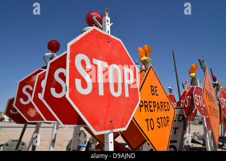 Traffic control signs await placement at a road construction site, Tucson, Arizona, USA. Stock Photo