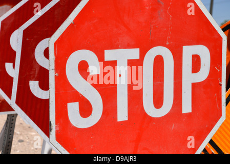 Traffic control signs await placement at a road construction site, Tucson, Arizona, USA. Stock Photo