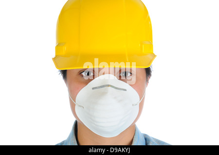 Closeup of a female construction worker wearing a yellow hard hat and dust mask. Horizontal format isolated on white. Stock Photo