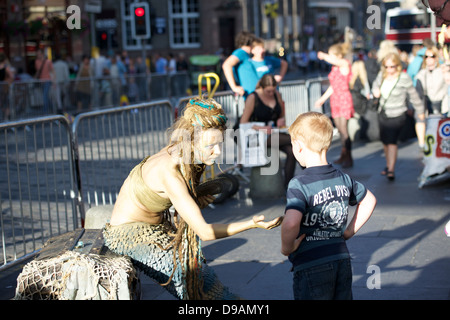 'Living statue' performing on the Royal Mile in Edinburgh. Stock Photo