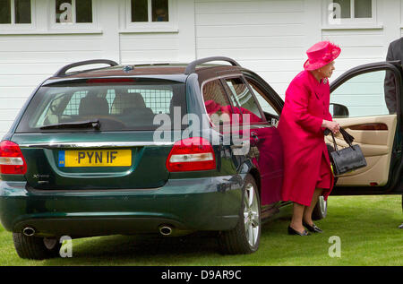 Egham, UK. 16th June, 2013. Britain's Queen Elizabeth II arrives in a car driven by herself for the Cartier Queen's Cup Final at Guards Polo Club in Egham, 16 June 2013. Photo: Albert Nieboerdpa/Alamy Live News Stock Photo