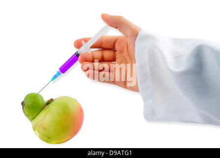 Genetic Modification - purple Liquid injecting into Apple Stock Photo