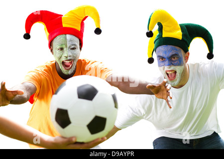 super soccer fans fighting for a soccer ball, isolated on white Stock Photo