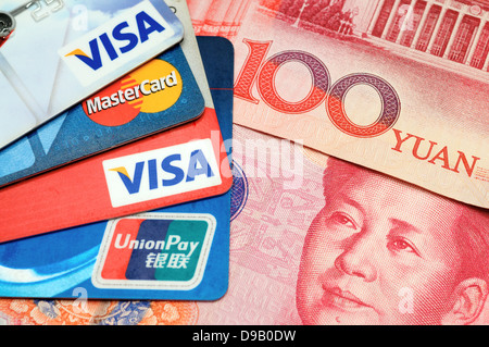 Closeup of VISA, Mastercard and Union pay credit cards with RMB Stock Photo