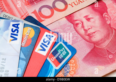 Closeup of VISA, Mastercard and Union pay credit cards with RMB Stock Photo